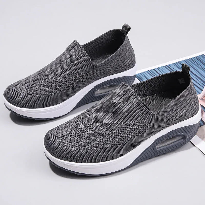 Women's mesh running shoes with air cushion sole in beige colour showing round toe and elastic lace design