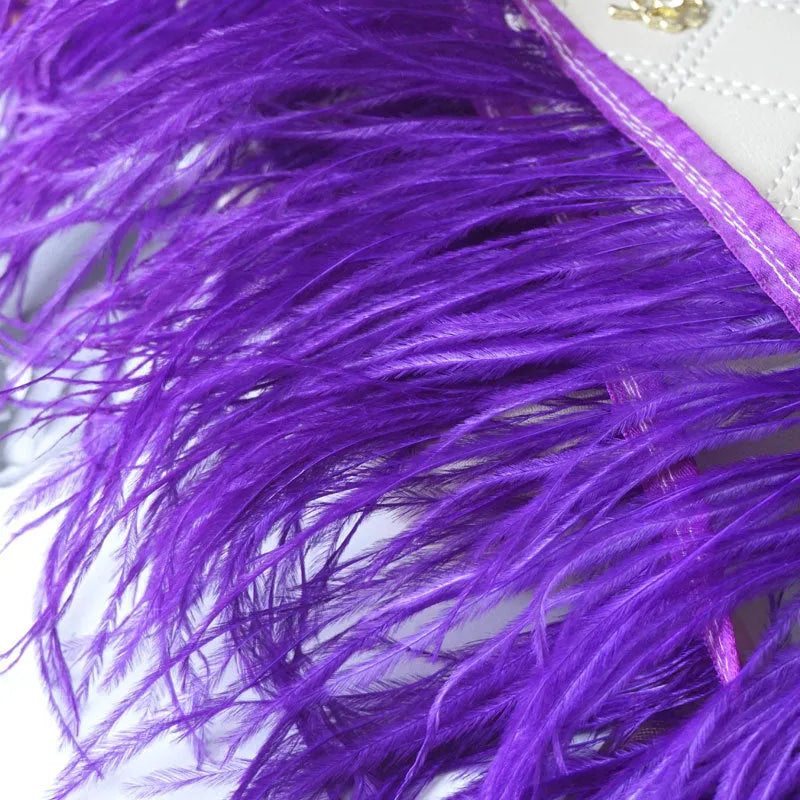 Decorative feather cloth strip in multiple colours including white, black, and mint green for DIY clothing and craft projects
