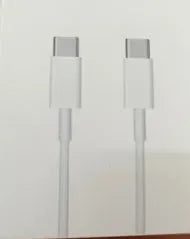 White 20W PD fast charger with UK plug and a USB Type-C charging cable.