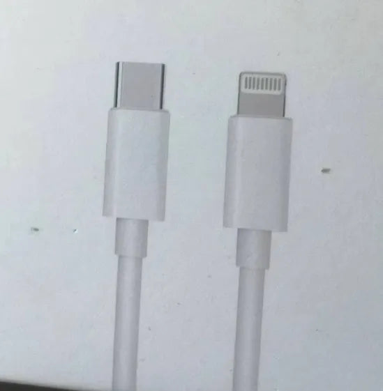 White 20W PD fast charger with UK plug and a USB Type-C charging cable.