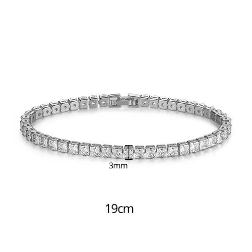 Women's copper tennis bracelet with geometric open-work design and cubic zirconia in gold finish on a light background