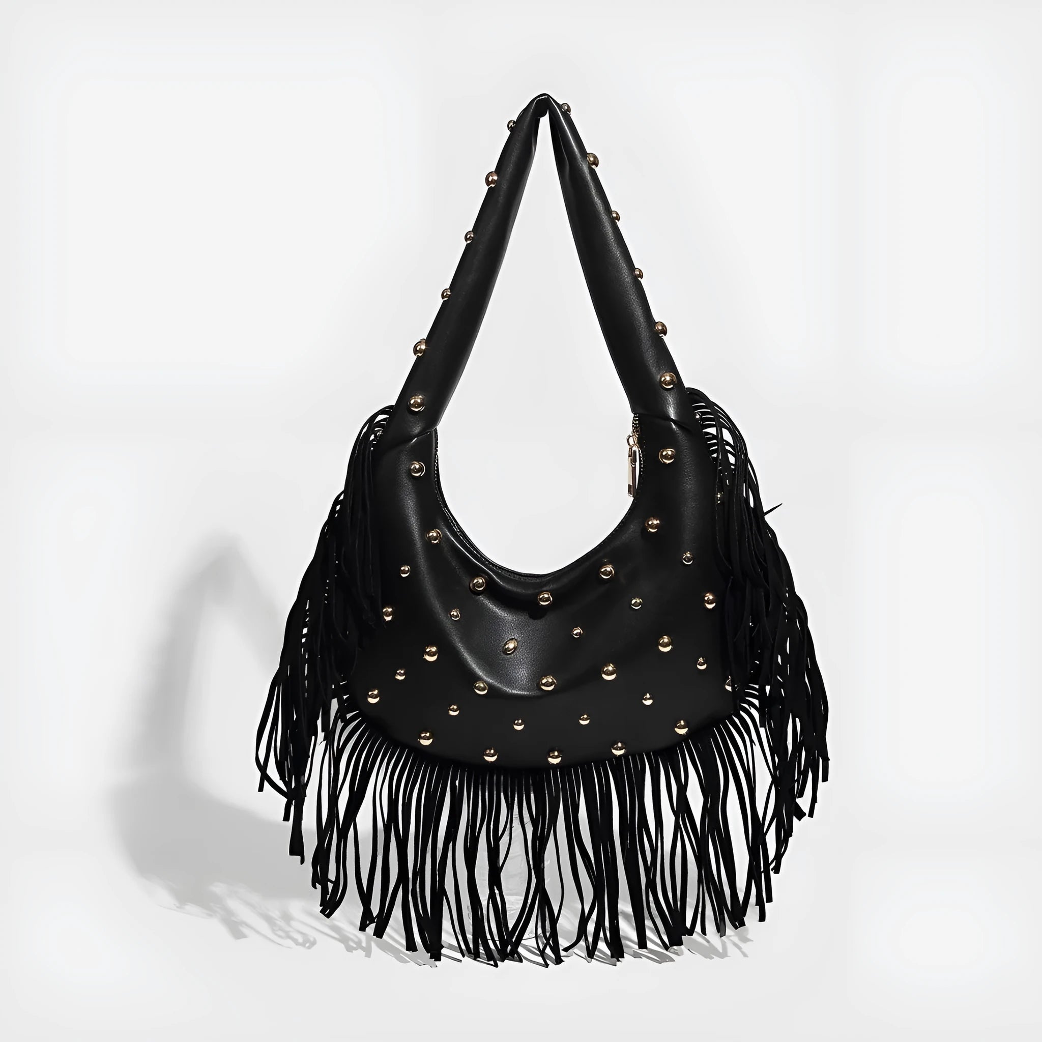 Retro tassel shoulder handbag in black colour showing decorative detail and shoulder strap