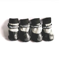 Pet dog soft bottom anti-scratch shoe cover in black on a light-coloured floor showing non-slip sole