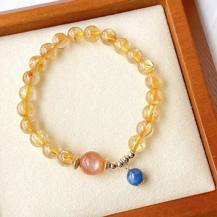 Handcrafted natural gold rutilated quartz sunstone bracelet with diamond-shaped and round crystal beads for women
