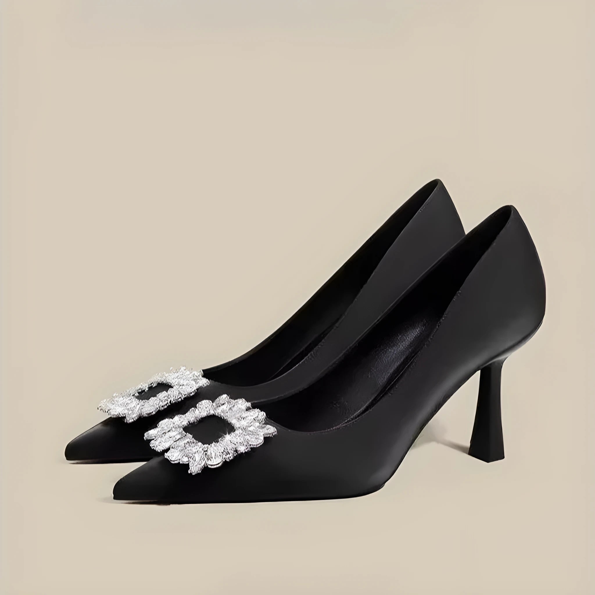 Women's pointed toe stiletto pumps in microfiber with a mid heel and rubber sole.
