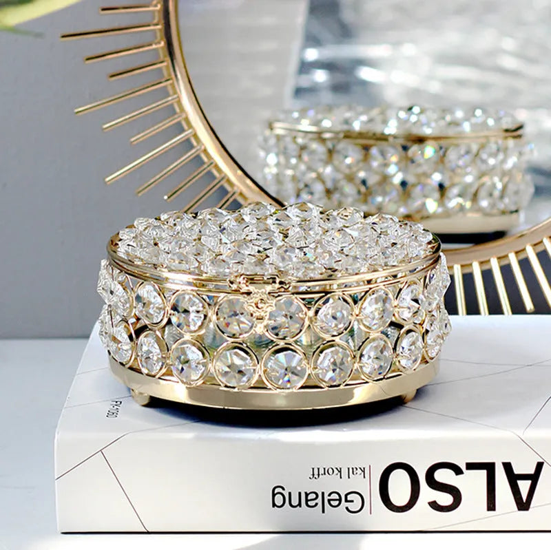 Transparent crystal glass jewelry box with a French gold metal frame in a European style.