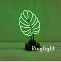 White bamboo-shaped desk lamp with green light, showing USB cable and two size options.