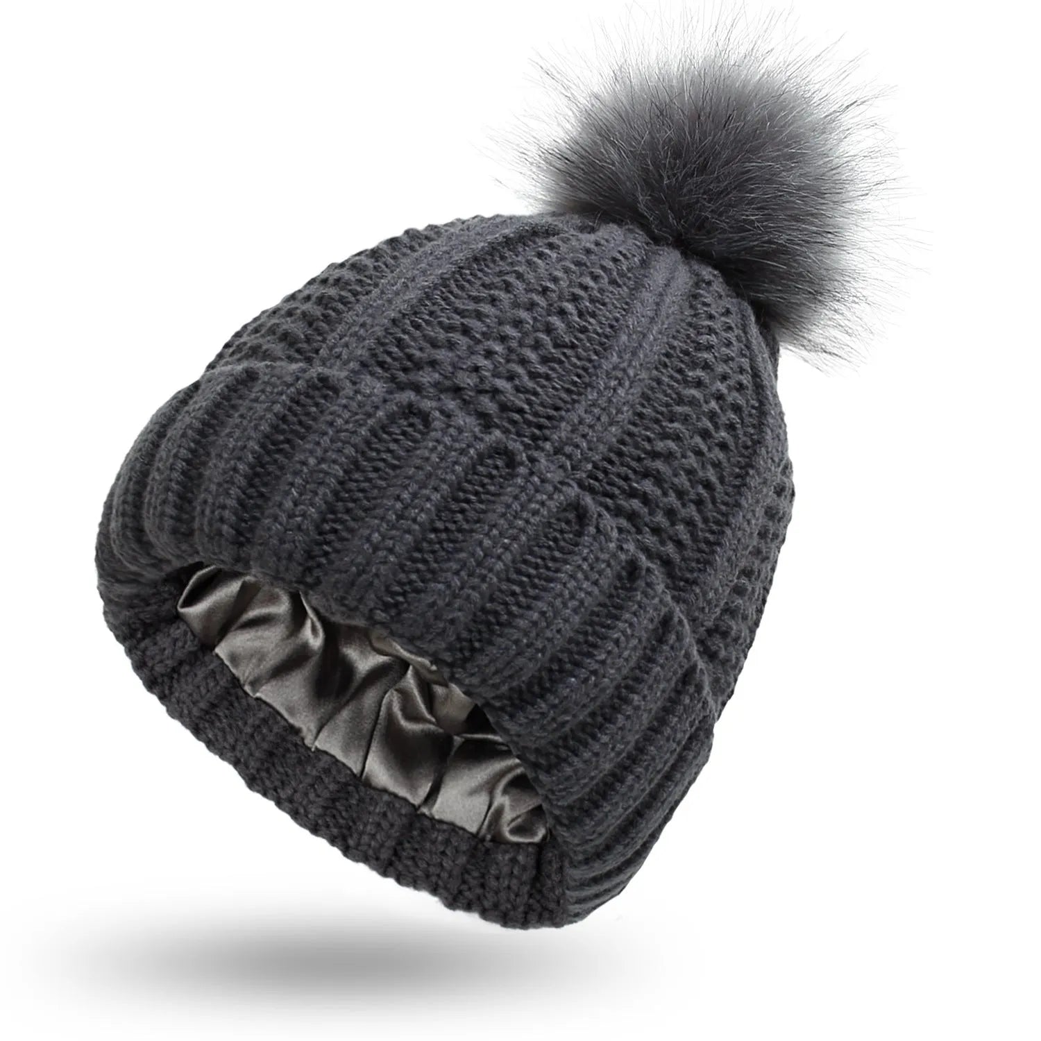 Women's knit beanie hat with faux fur pom pom in wine red, showing satin lining with paisley pattern.