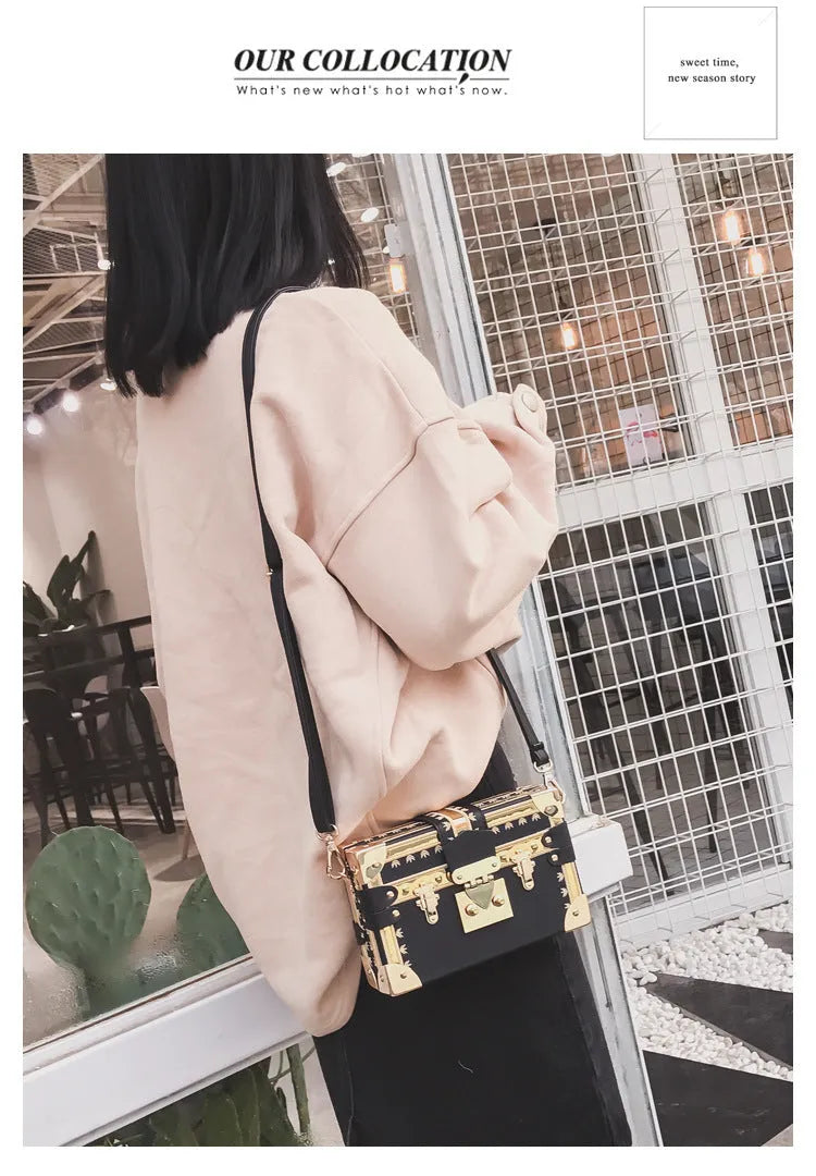 Women's black or green hard flap top shoulder bag made of PU leather with rivet details.