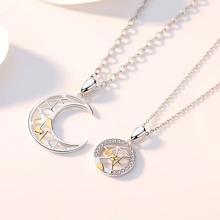 Sun and moon tooth couple necklace set with copper electroplated pendants and cross chain.