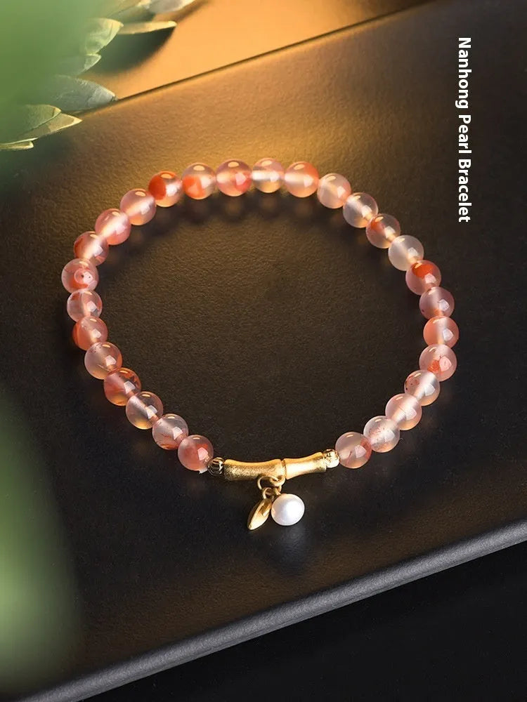 Nanhong agate bracelet with bamboo joint and floral design in ethnic style.