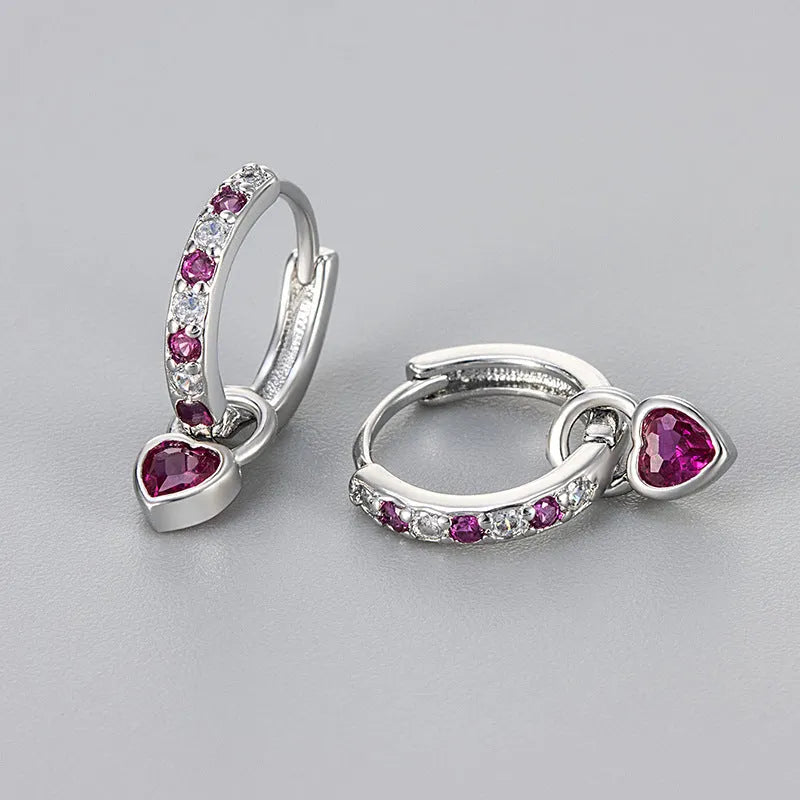 Gold-coloured clip-on earring for women with a heart-shaped drop featuring a pink zircon stone.