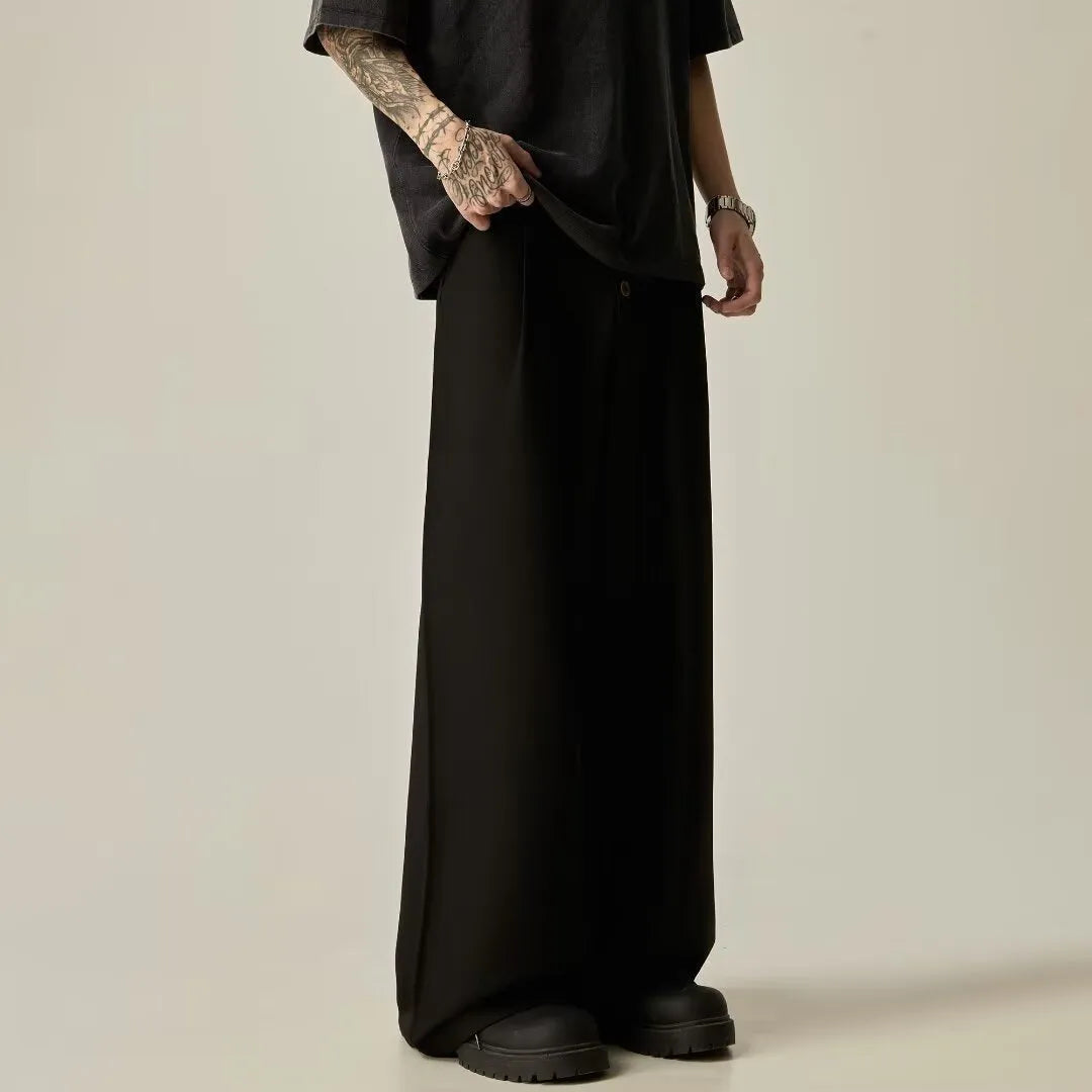 Men's solid colour cotton blend wide-leg casual trousers on a hanger, showing the straight-leg cut and button fly.