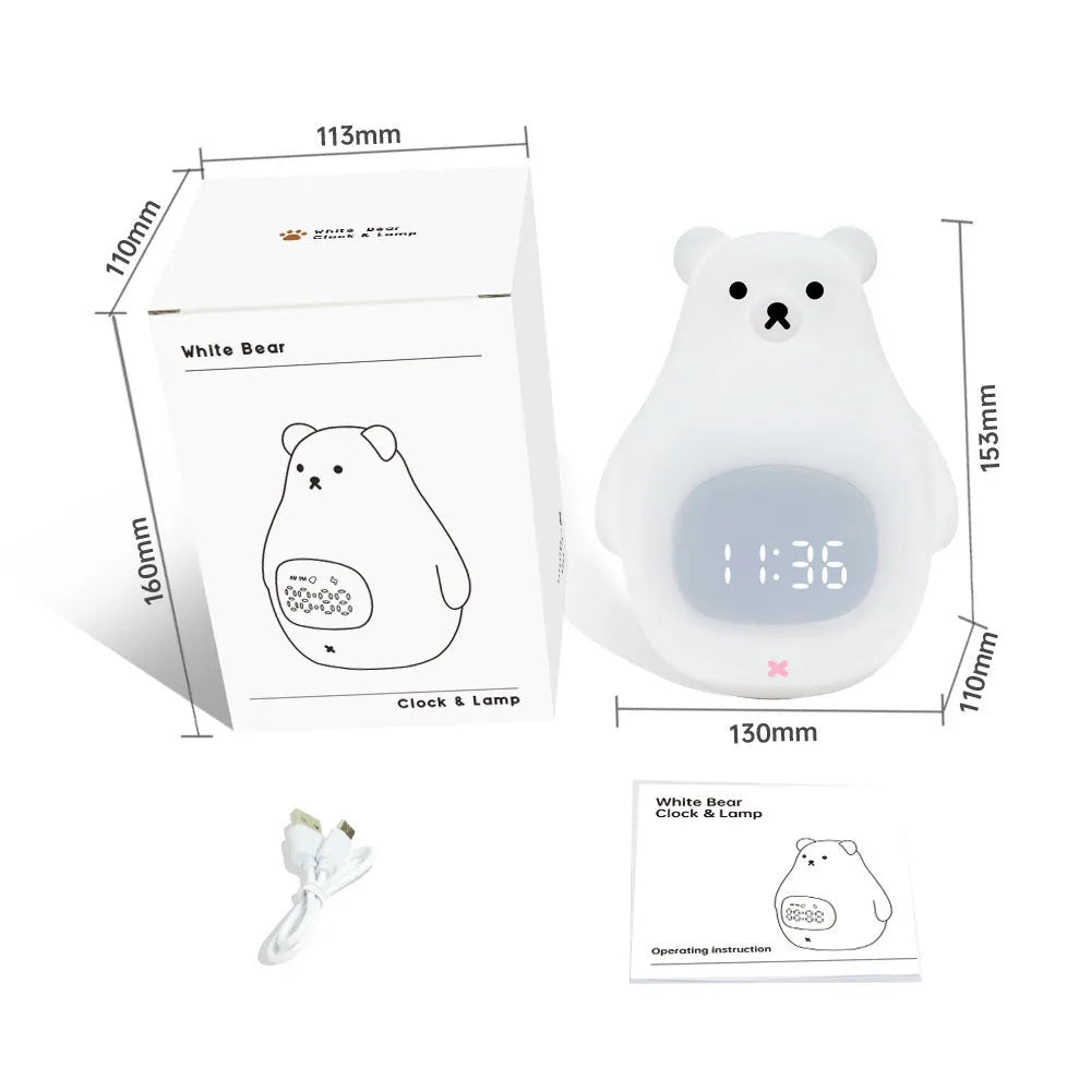 White silicone bear-shaped night light with remote control on a wooden bedside table.