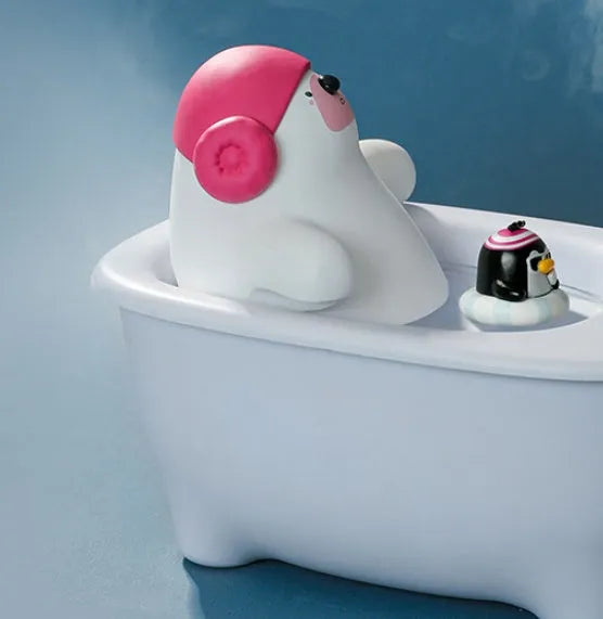 White compact USB air humidifier with large water tank on a desktop.
