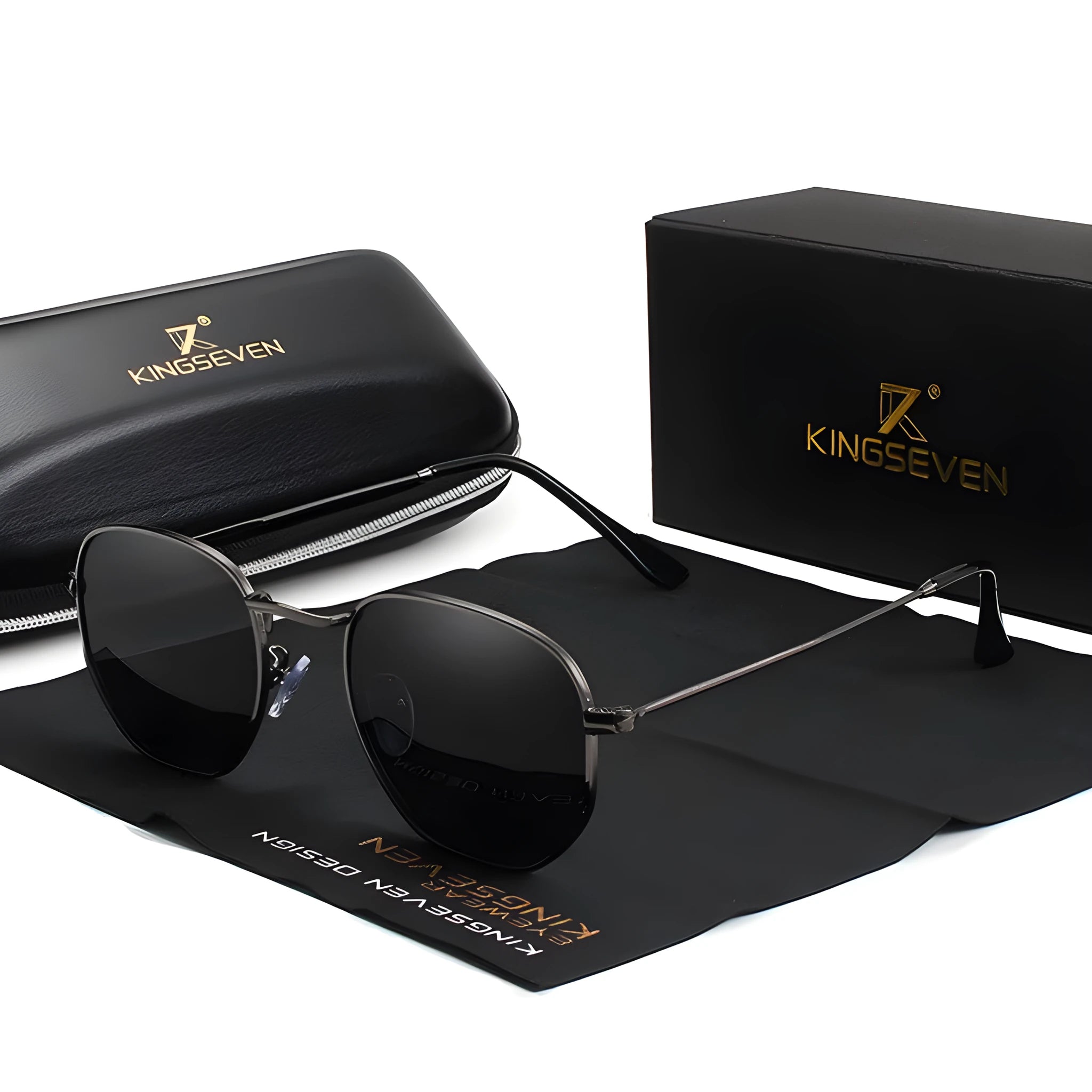 Classic round metal frame sunglasses for men in gun grey colour with UV400 lenses on a table.