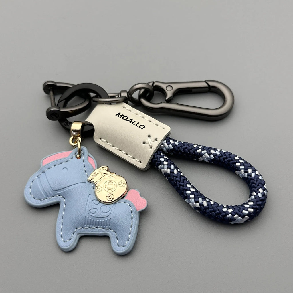 Handmade cowhide key ring pendant with a detailed zinc alloy pony buckle and coloured flannelette rope.
