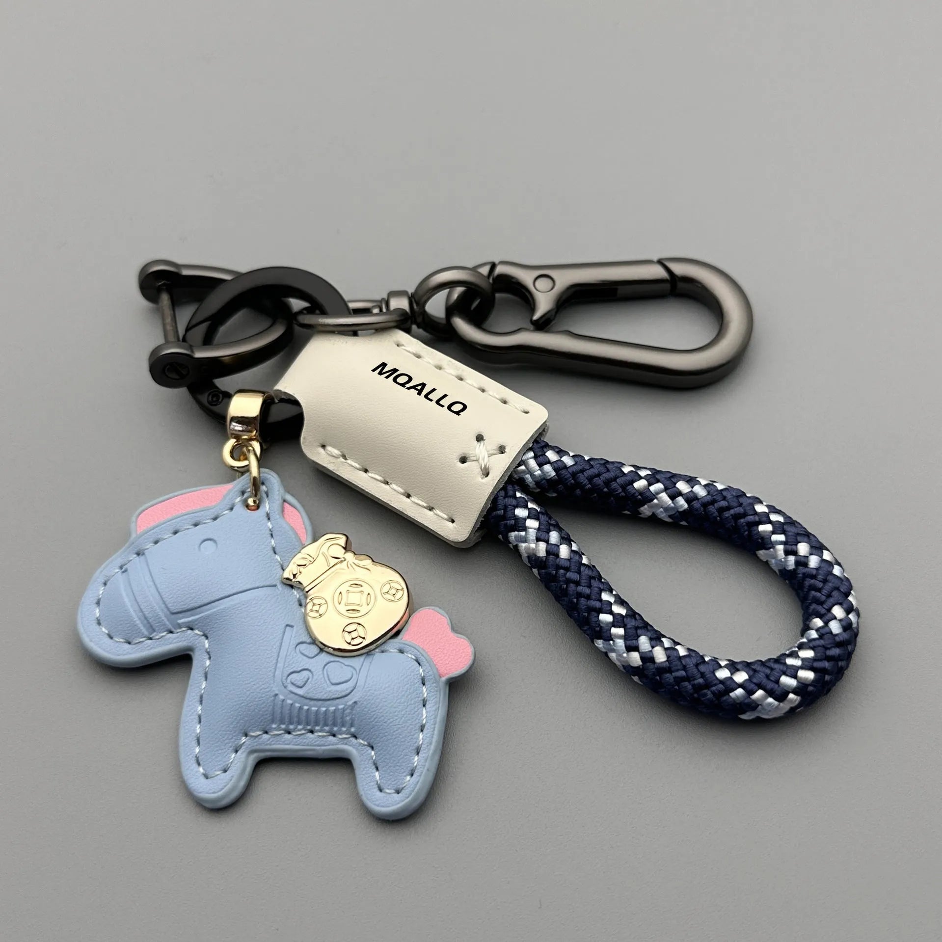 Handmade cowhide key ring pendant with a detailed zinc alloy pony buckle and coloured flannelette rope.