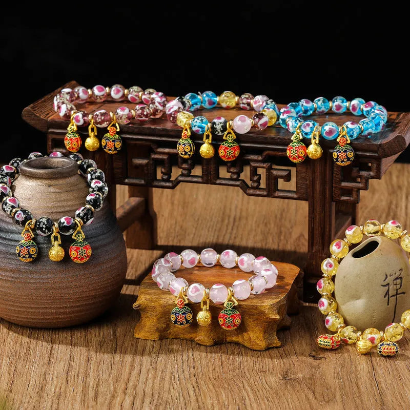 Handmade heart-shaped glass bead bracelet with ancient fluorescent glaze and swallowing gold beast design