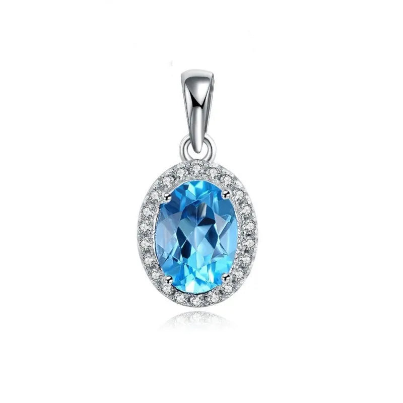 Geometric design women's sterling silver and blue topaz jewellery set showing earrings, ring, pendant, and necklace.