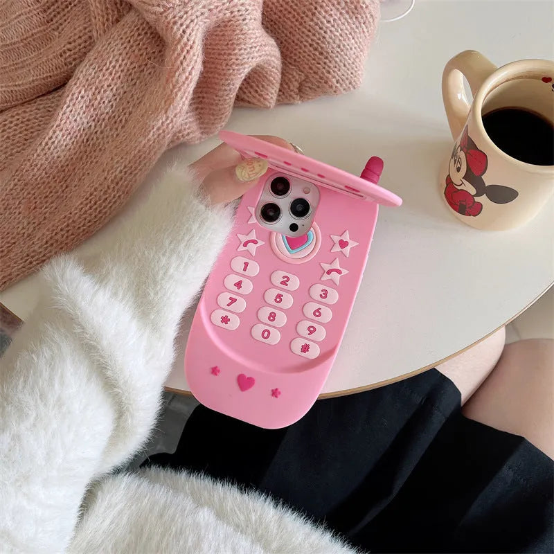 Pink silicone flip phone case with a mirror for iPhone models.
