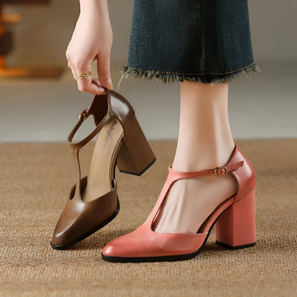 Women's pink and dark brown retro Mary Jane shoes with a pointed toe, buckle, and hollow design detail.