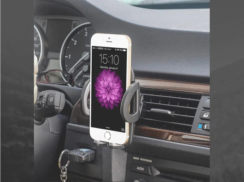 Black universal car mobile phone holder mounted on air conditioning vent