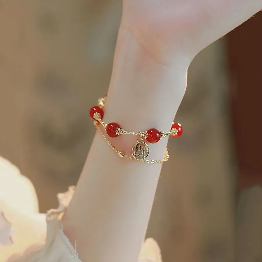 Red agate and alloy double-layer women's bracelet with Hongma lucky charm pendant on wrist