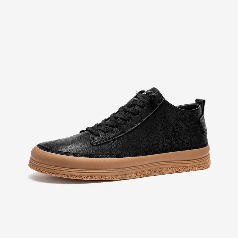 Men's black casual leather shoes with round toe and white rubber sole on a plain background.