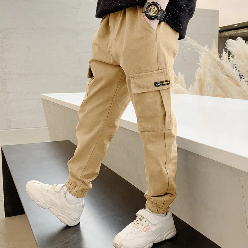 Boys' casual cotton summer trousers in khaki colour with elasticated waist, shown on size chart.
