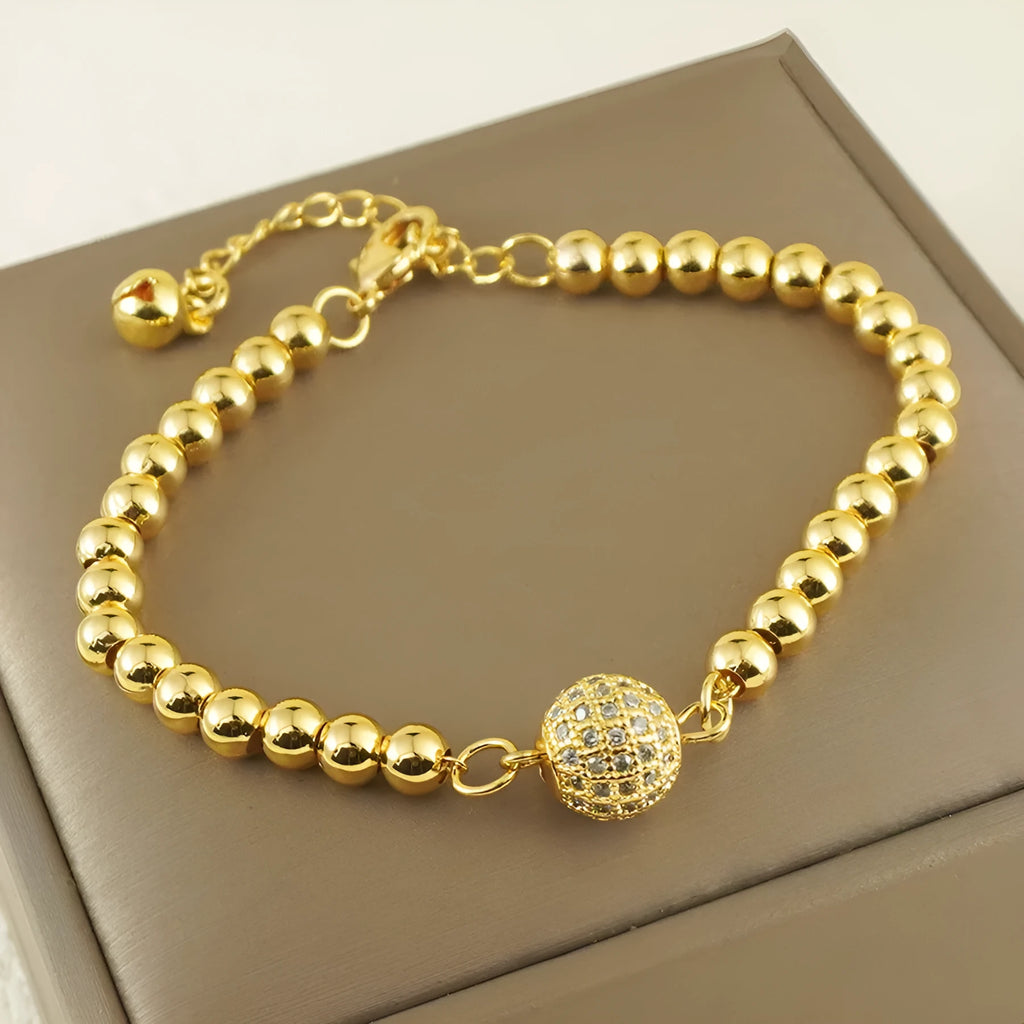 Women's copper bracelet with a heart-shaped design and a single ball zircon detail.