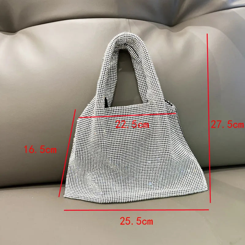 Silver cotton thread evening handbag with shiny rhinestone detailing and open outer pocket