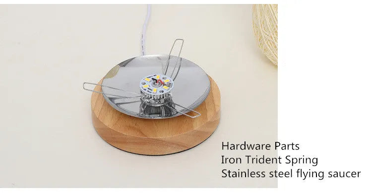 Brown hemp rope sphere desk lamp with wooden base on a desk