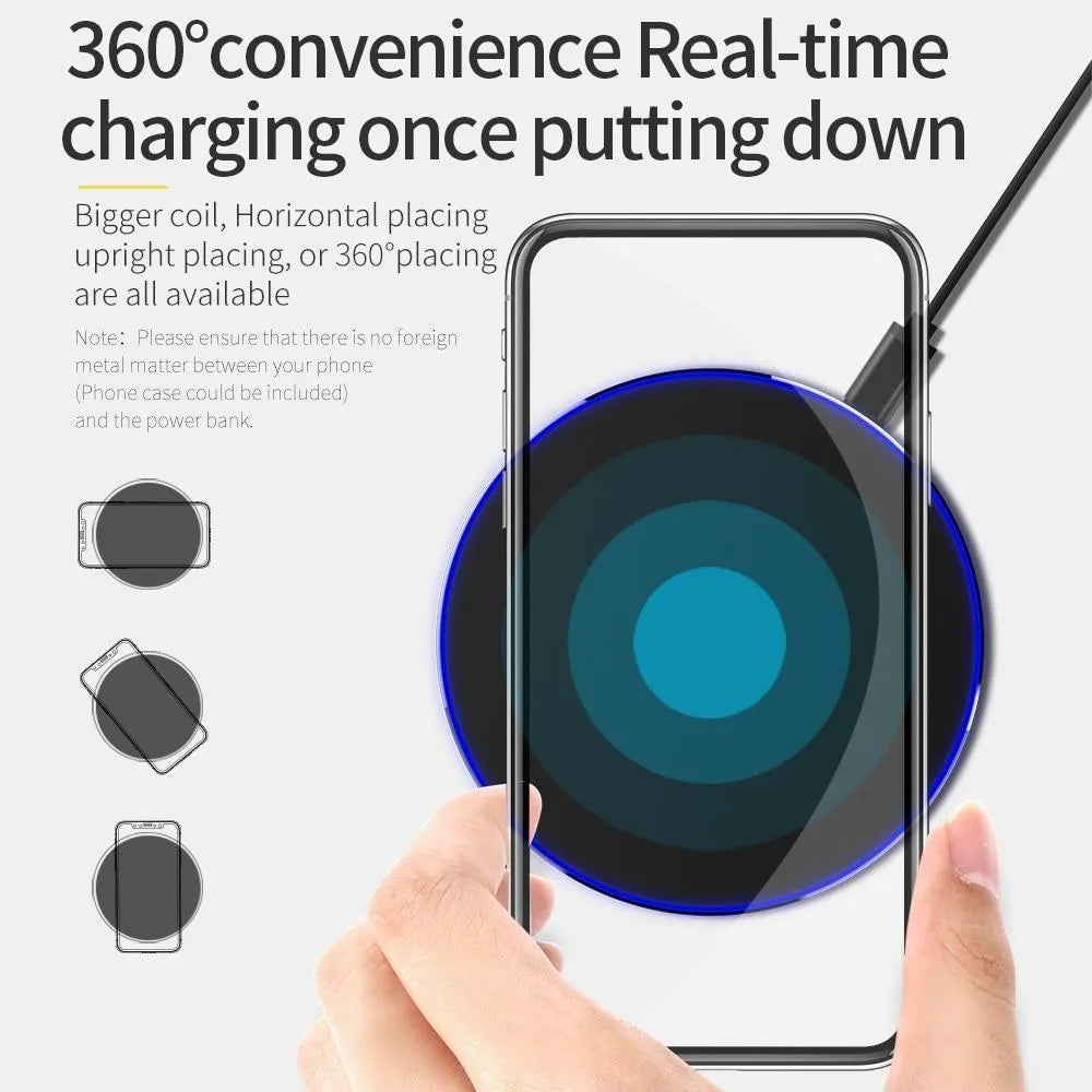 Ultra-thin black aluminium QI wireless charger with USB cable on wooden surface