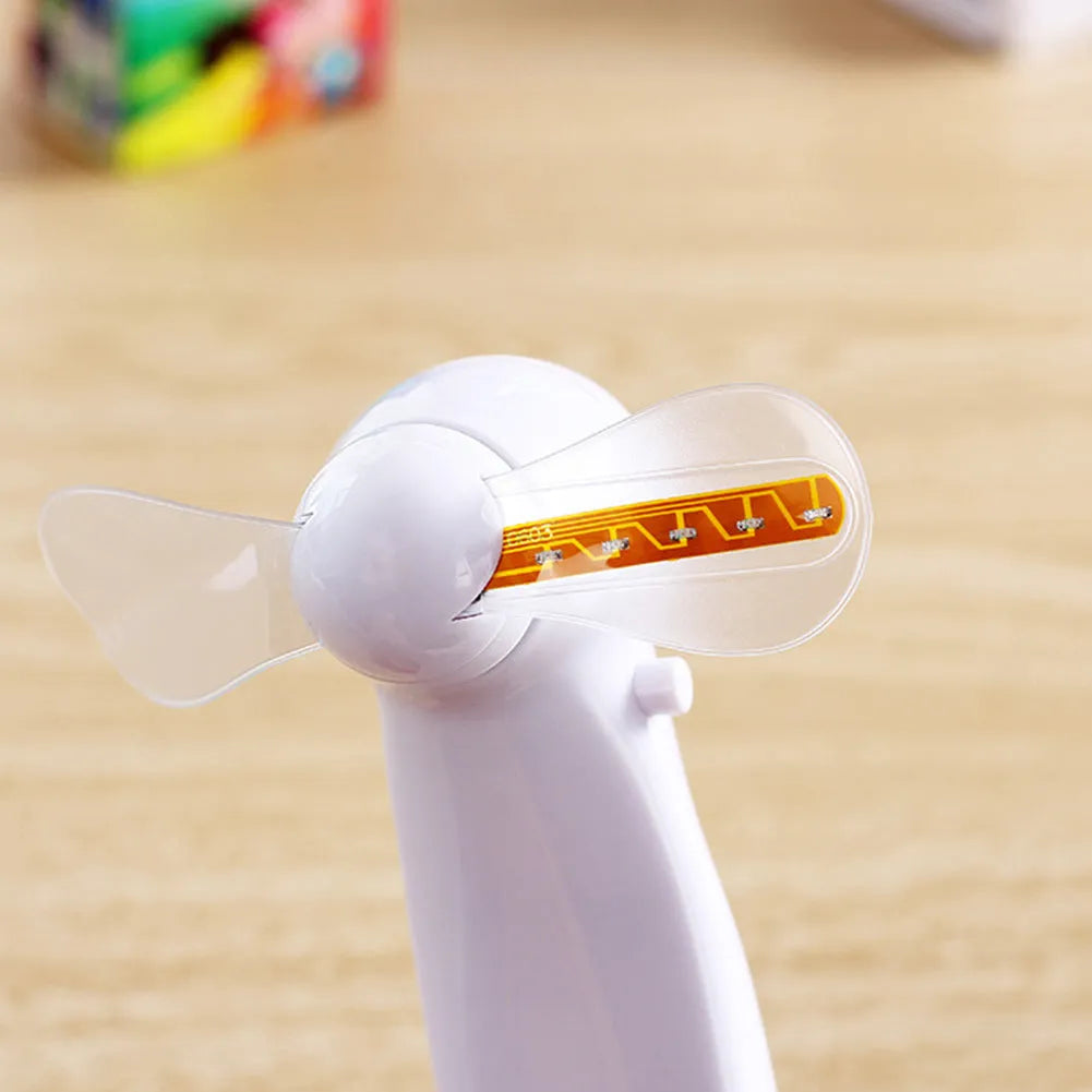 White handheld mini fan with flashing blue I Love You LED display, showing dimensions.