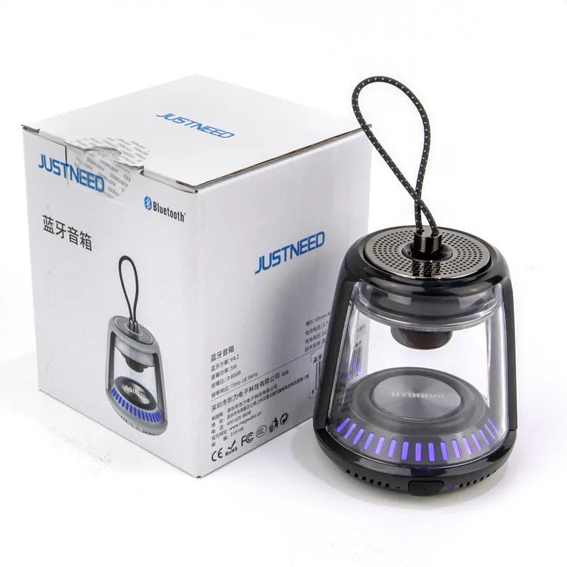 Portable mini Bluetooth speaker in black or white with 5W output, 850 mAh battery and waterproof anti-fall design.