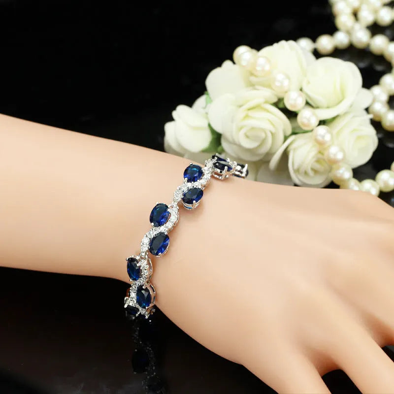 Copper gold electroplated bracelet with AAA+ zircon stones in geometric design measuring 18.4 cm length