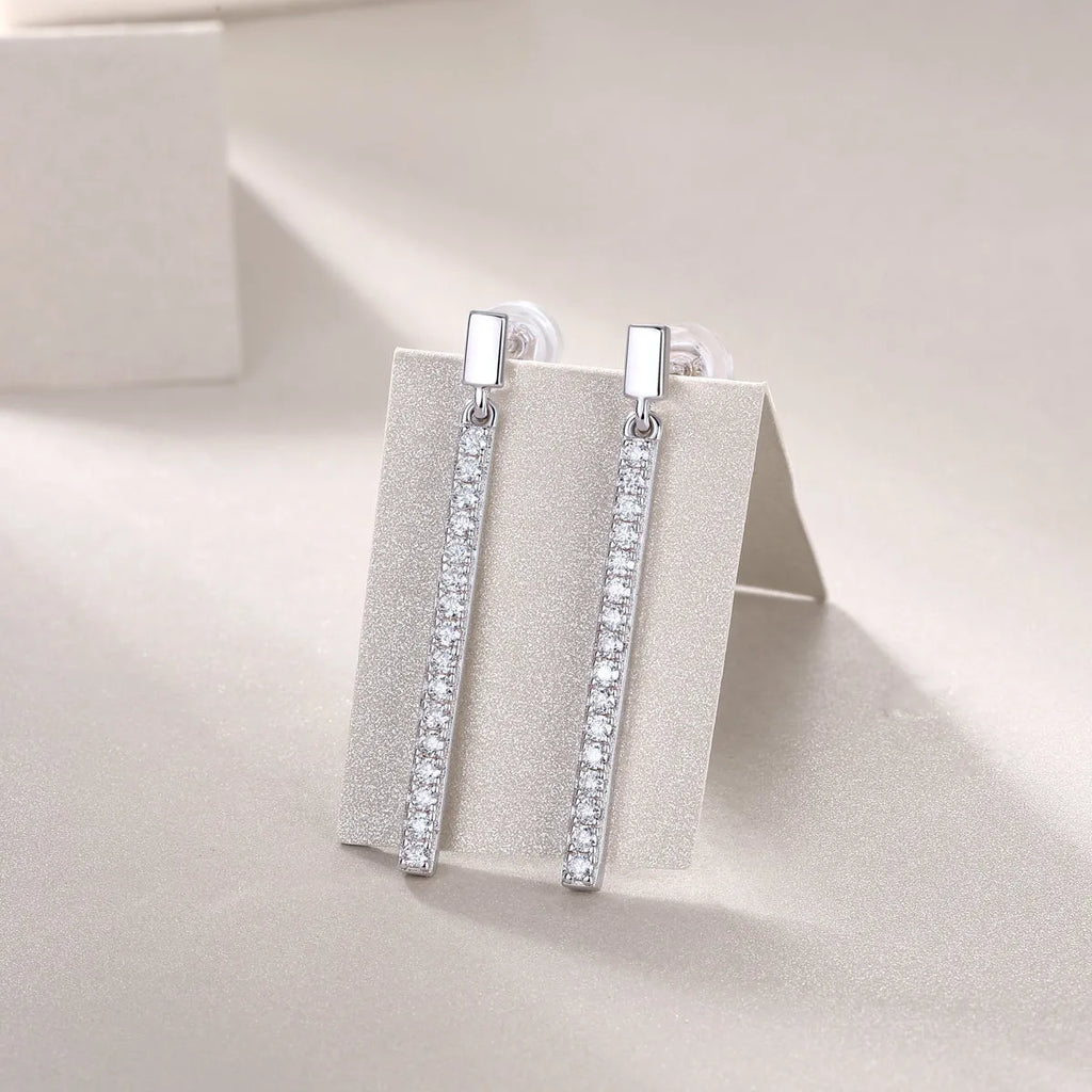 Pair of moissanite stud earrings in S925 silver with platinum plating on white background