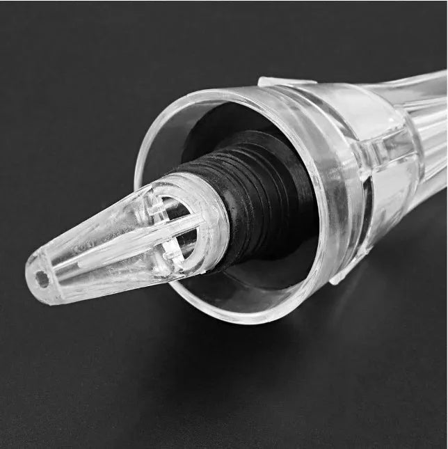 A clear acrylic wine aerator with a stainless steel filter, measuring 16cm long.