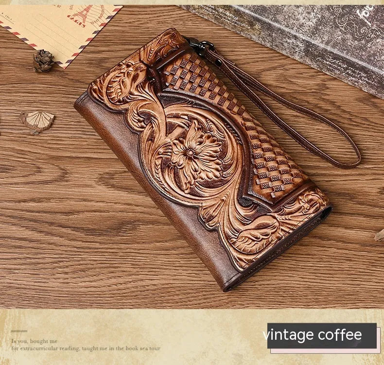 Brown tri-fold leather wallet with deep embossed floral pattern, shown open to reveal card slots and lining.