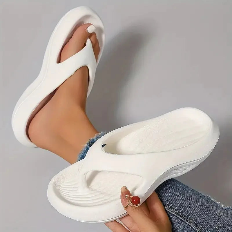 Women's thick-soled flip-flops in black, white and grey colours with non-slip EVA construction