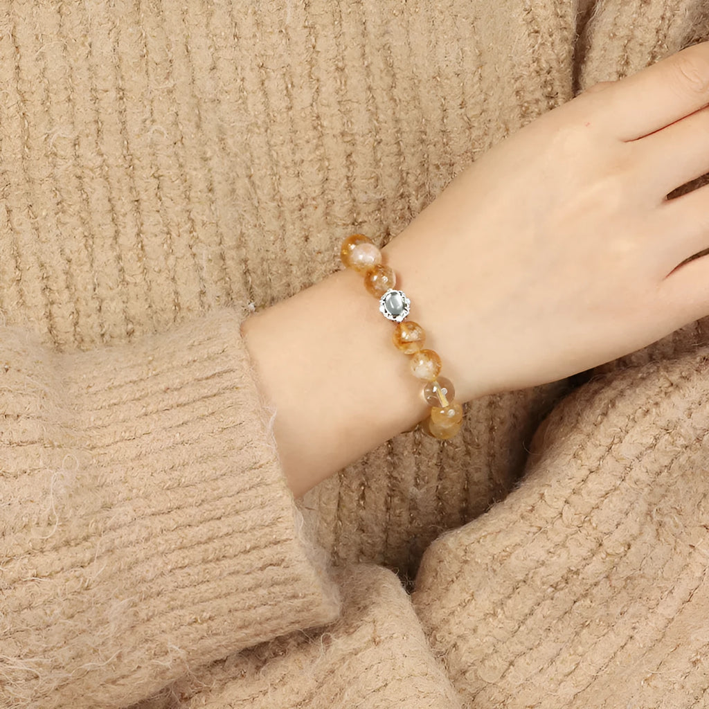 Citrine crystal bracelet with 10mm geometric shapes on wrist.