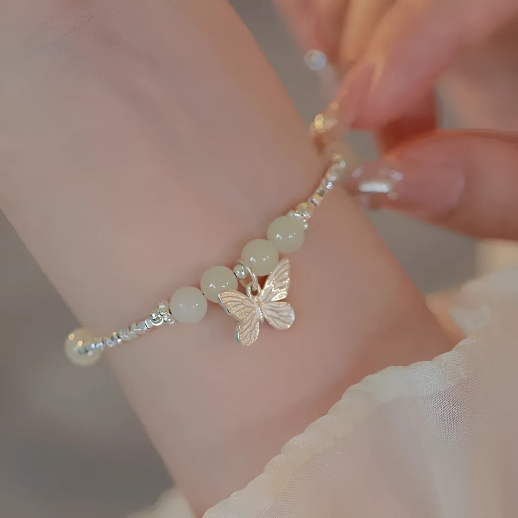 Copper bracelet and necklace set with silver electroplating and butterfly designs featuring Hetian jade accents