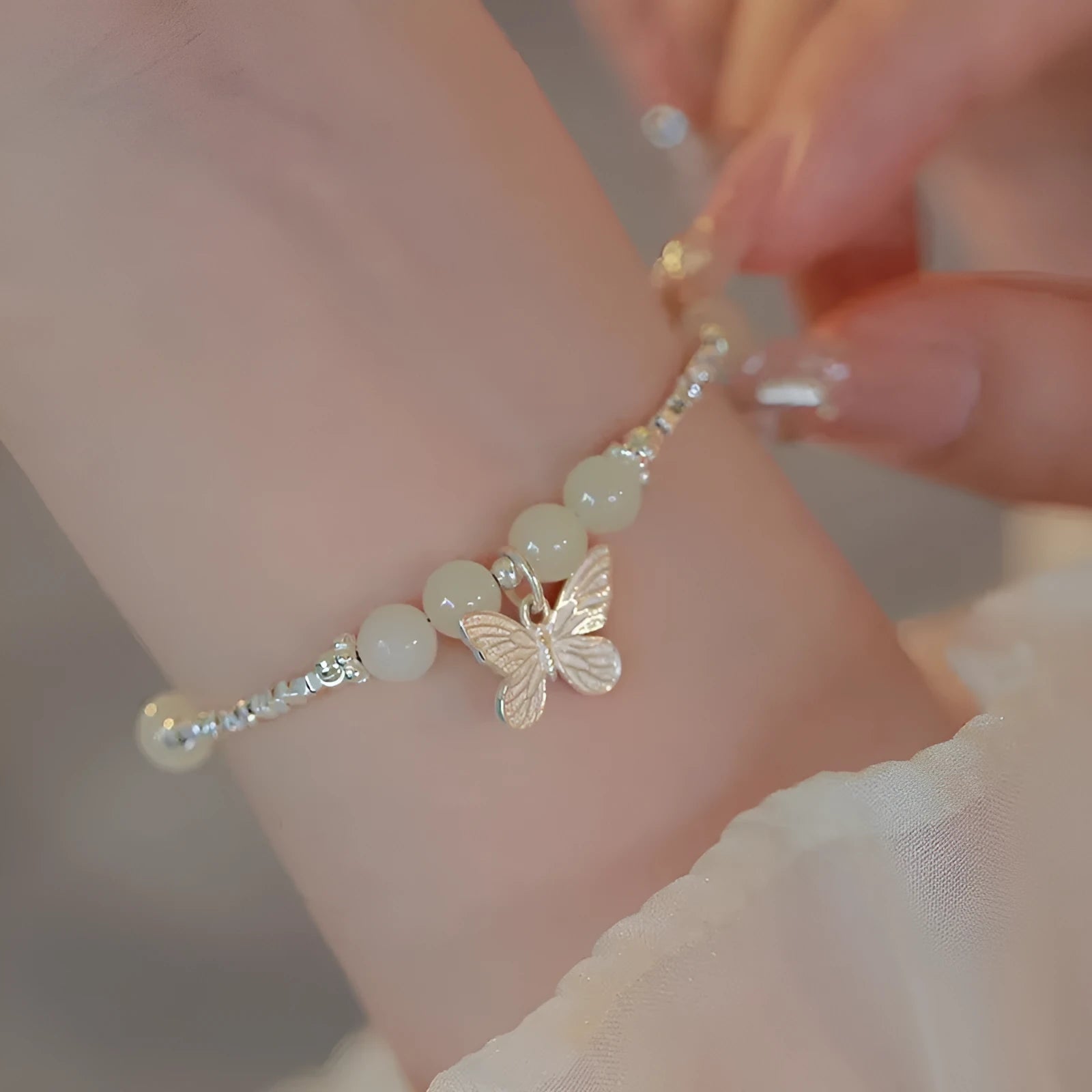 Copper bracelet and necklace set with silver electroplating and butterfly designs featuring Hetian jade accents