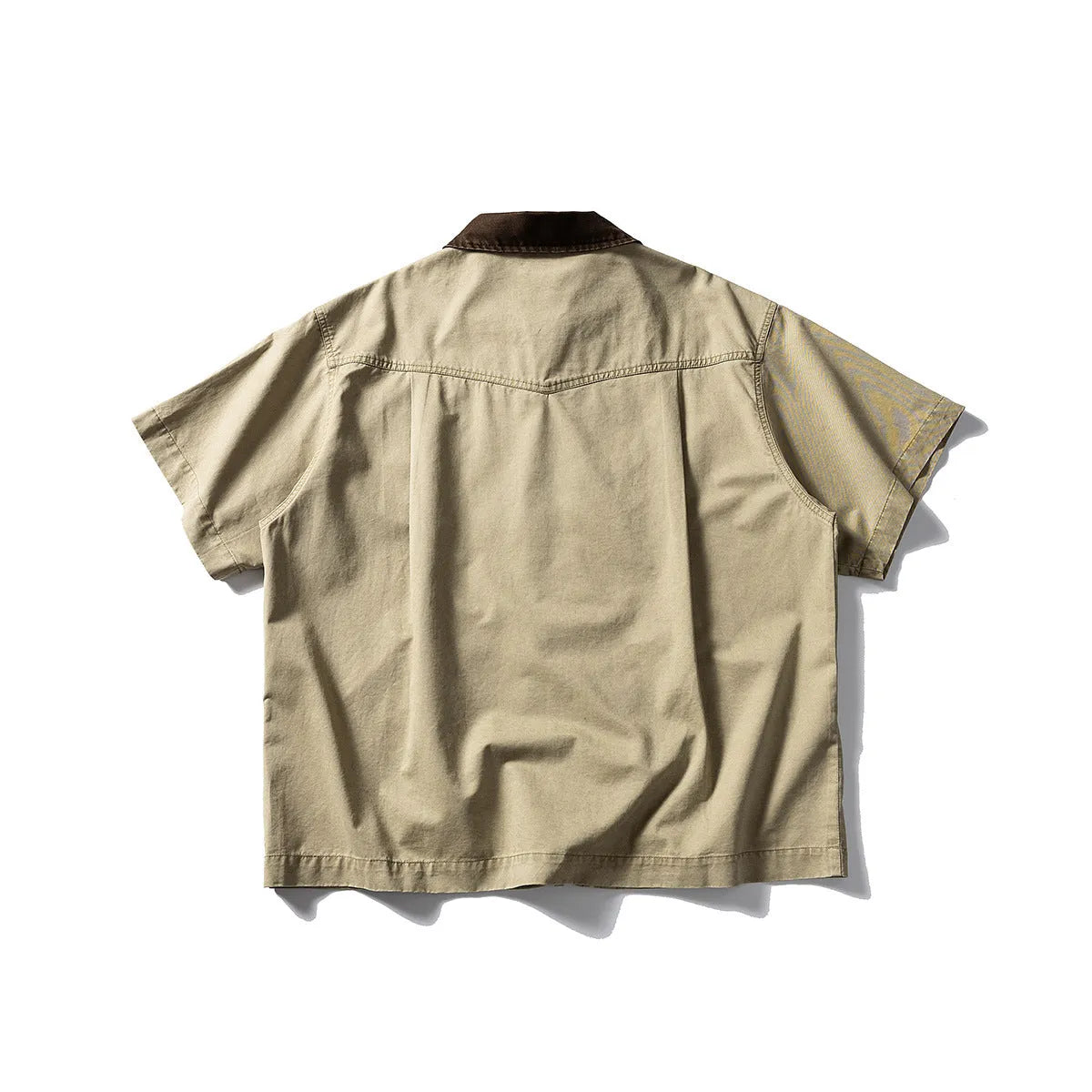 Grey washed cotton short sleeve overall shirt on a hanger, loose fit.
