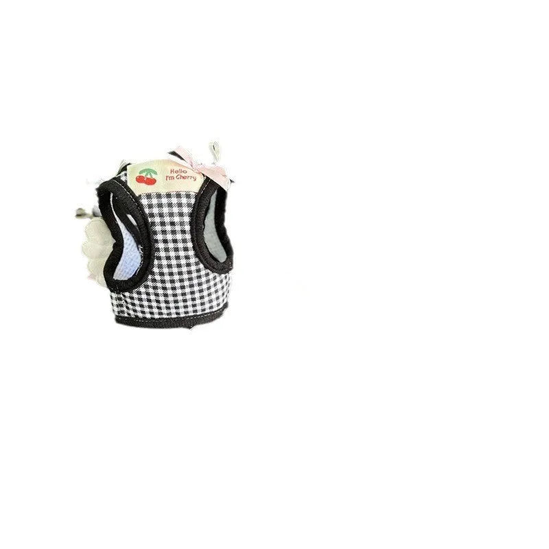 Pink and black cotton chest and back harness with rope leash for a small dog on a white background.