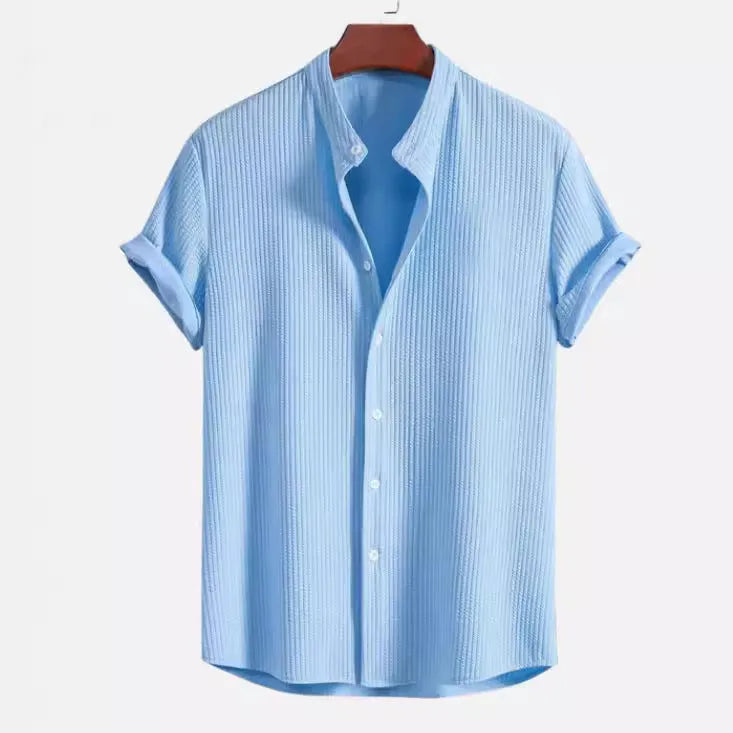 Mans loose-fitting short sleeve casual shirt in solid colour on hanger.