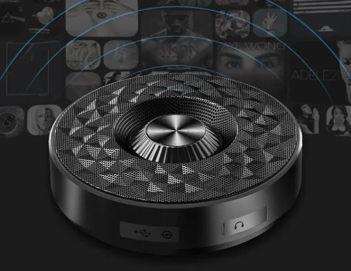 Compact black, orange, and silvery white Bluetooth wireless sound box speaker on a surface.