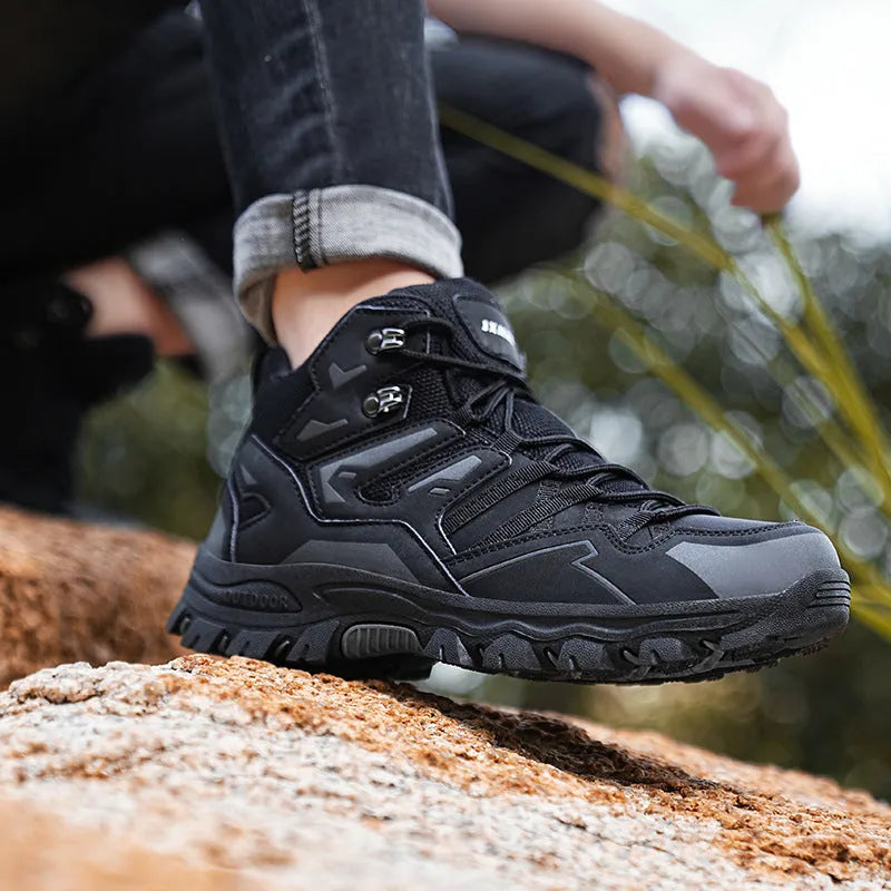 Men's and women's flannel hiking sneakers in various colours on a rocky outdoor path.