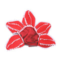 Dog wearing Halloween demon headband costume with chomper teeth and pink flower decoration